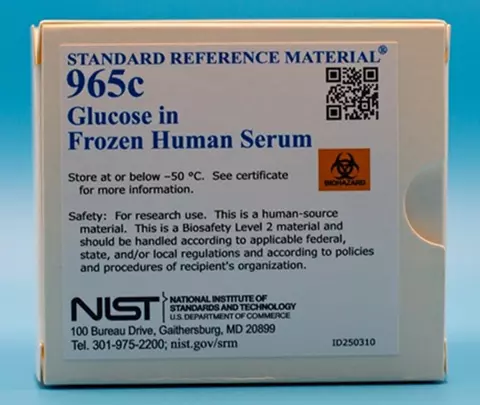 picture of a white box with a sticker label with a sticker label containing words Standard Reference Material 965c Glucose in Frozen Human Serum