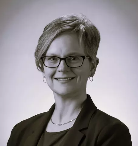 Black and white professional headshot of Kate Beers