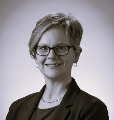 Black and white professional headshot of Kate Beers