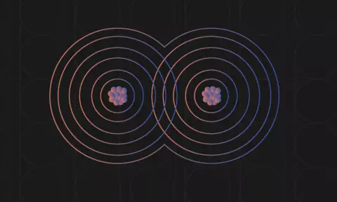 Diagram shows two atoms as sets of overlapping circles with nuclei in the centers. 