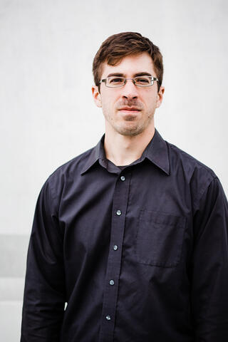 Alex Cap poses for a head shot