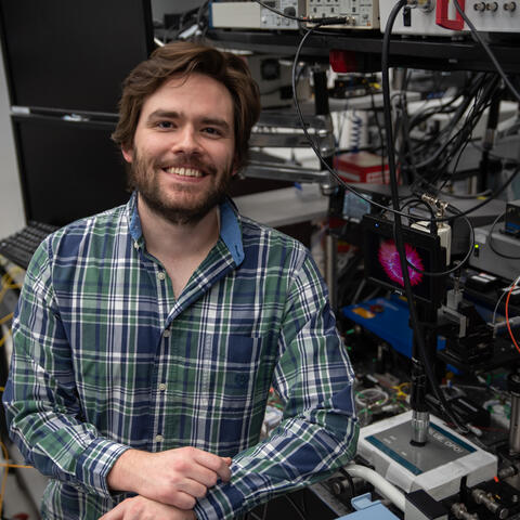 Man sitting in front of lab equipment