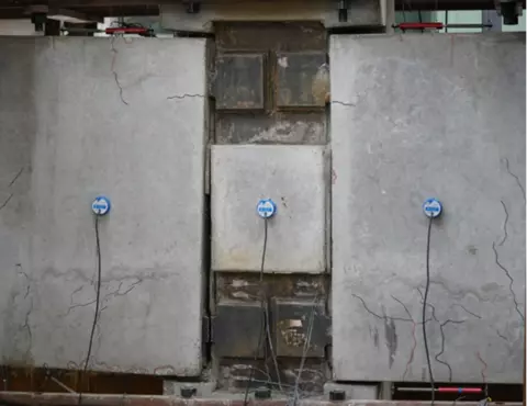 Structural Components under Multiple Hazards. Concrete with cracks.