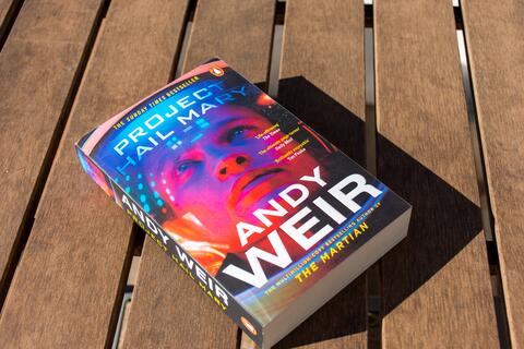 The novel Project Hail Mary sits on a table. 