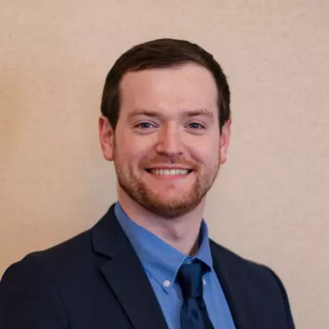 A headshot image of Patrick Buckley