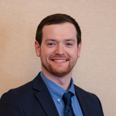A headshot image of Patrick Buckley