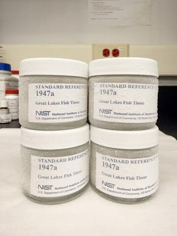 Four identical frosted-over jars are labeled 1947a, Great Lakes Fish Tissue.