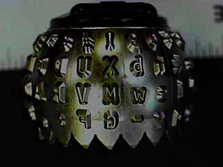 ball element image-An element used in a single element typewriter