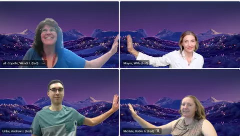 Screenshot from a virtual meeting with Wendi Copello (top-left), Willa Mayns (top-right), Andrew Uribe (bottom-left), and Robin McHale (bottom-right) smiling for a group photo and posed in a virtual high-five by placing a hand against the inside vertical edge of each of their respective video frames. 