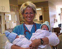 A nurse welcomes two new arrivals at Poudre Valley Hospital, part of the Poudre Valley Health System honored with the 2008 Baldrige National Quality Award.