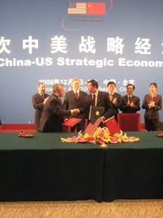Group of people stand behind a table