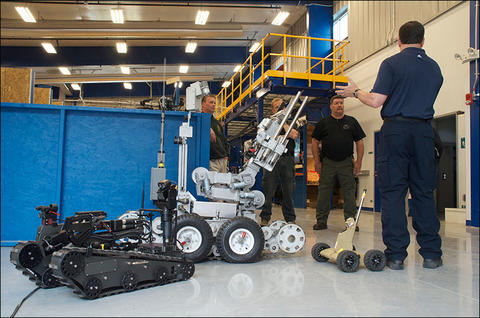 NIST engineer Adam Jacoff with Bomb Squad and robots