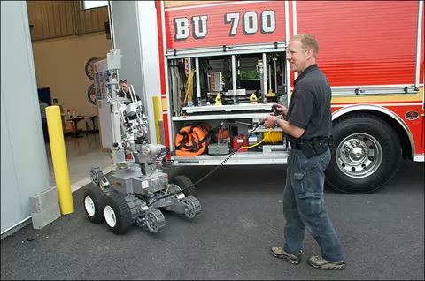 MC-bomb-squad-member-with-robot-web