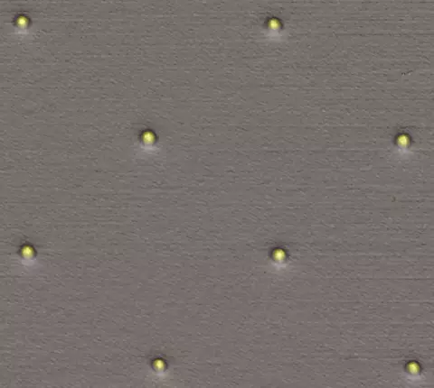 The gold posts in this colorized micrograph, averaging 450 nanometers in diameter, are used to anchor individual biomolecules such as DNA for studies of their mechanical properties.