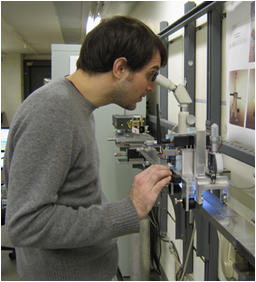 Technician measuring metal tape