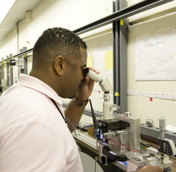 Daniel Sawyer makes a measurement using the interferometer.