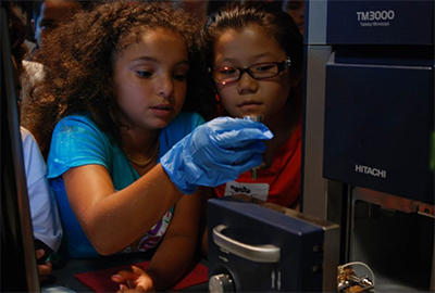 Student uses a tabletop SEM