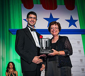 Jacob Taylor receives Service to America Award with acting Secretary Blank
