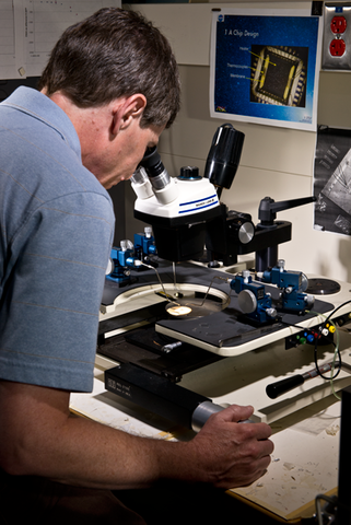 Tom Lipe at a microscope