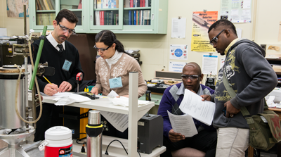 four students perform calculations