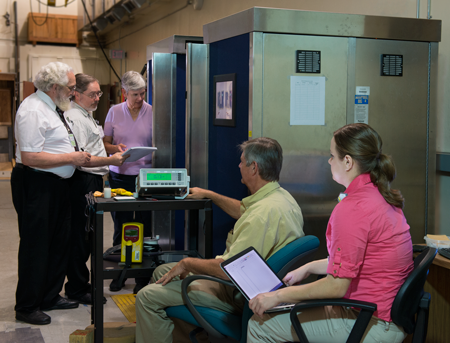 NAS team and National Academies representatives with scanner