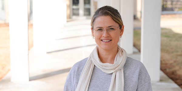 Justyna Zwolak poses for a casual photo outdoors on the NIST campus.