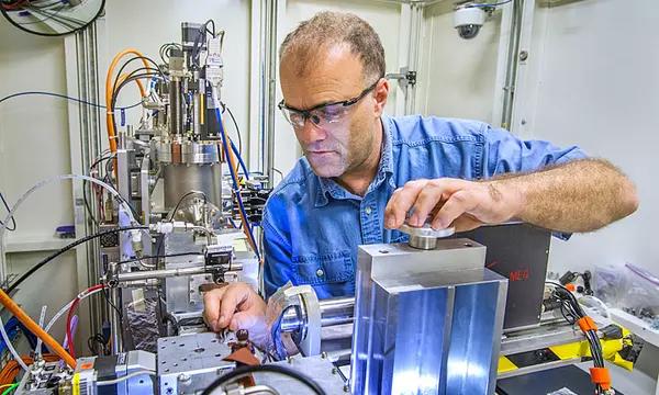 Picture of the sample area of the NIST X-ray Adsorbtion Fine Structure instrument, with NIST scientist Bruce Ravel, located at the National Synchrotron Light Source.