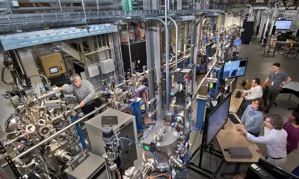 The NIST Synchrotron Science Group working at the SST-I (middle front) and SST-II (front left) beamlines. In the background, the safety hutch for the hard X-ray beamline BMM can be seen (top right).