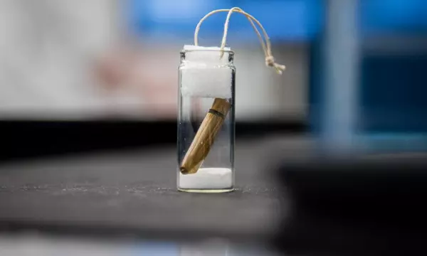 a bullet inside a small glass vial