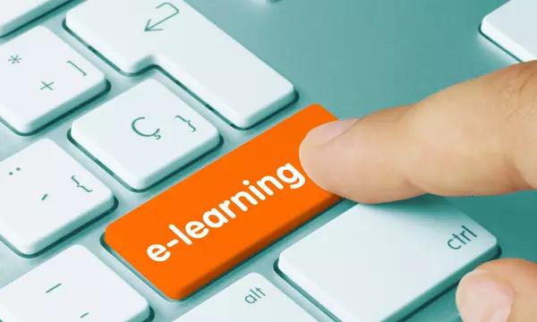 Finger tapping orange key on keyboard e-learning