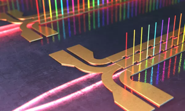 Illustration shows tiny columns of light in different colors standing vertically along circuits on a chip. 