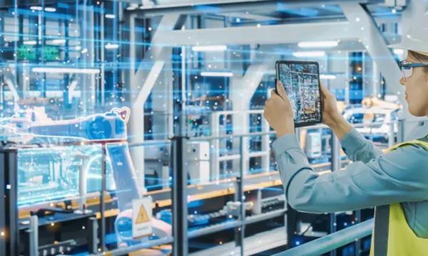 Female Automotive Engineer Using Augmented Reality Tablet Computer to Scan Automated Robot Arm Assembly Line Manufacturing Electric Vehicles