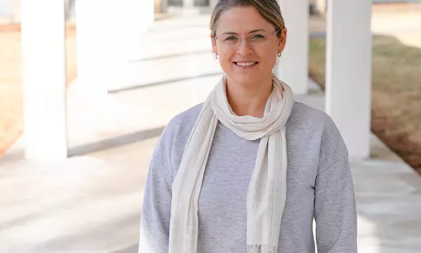 Justyna Zwolak poses for a casual photo outdoors on the NIST campus.