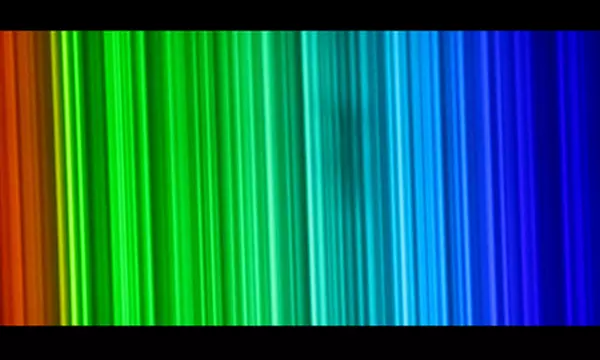 Vertical lines of light change from red to green to blue going left to right.