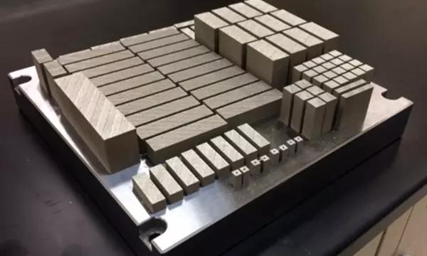 Additively-manufactured specimens for mechanical testing. Specimens have varying build directions to measure possible anisotropy of properties we own this image.