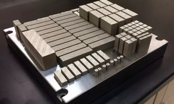 Additively-manufactured specimens for mechanical testing. Specimens have varying build directions to measure possible anisotropy of properties we own this image.
