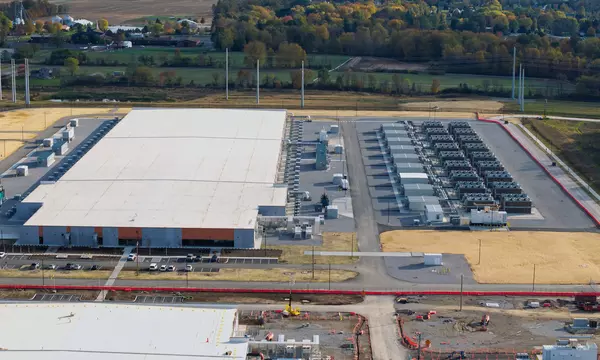 Large scale AI data center and server farm campus operating in rural landscape
