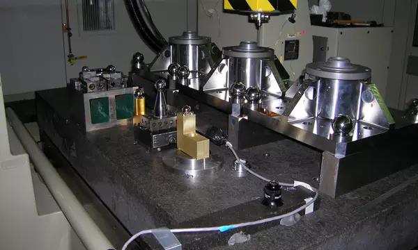 Three of the four James Webb Space Telescope Primary Mirror Backplane Support Structure fixtures on the NIST M48 Coordinate Measuring Machine.