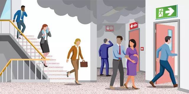 An illustration depicting office workers in a stairwell trying to take a safe exit, shown in green, during a fire emergency.