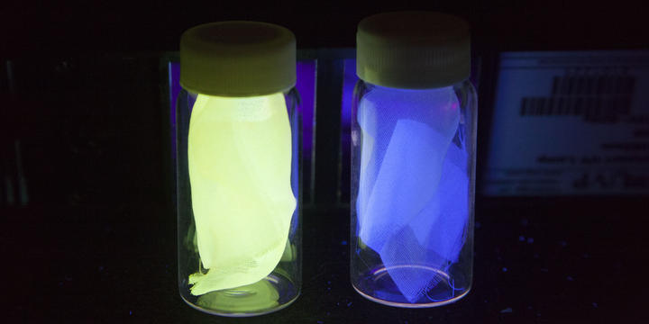 Examples of the silk used in experiments to detect damage in composites, shown under black light.