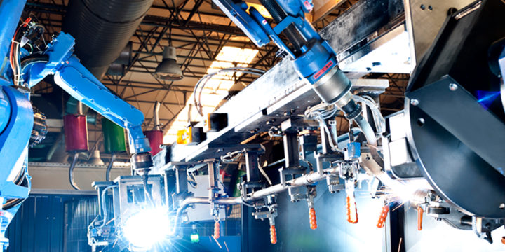 Industrial robot in a manufacturing facility stock photo