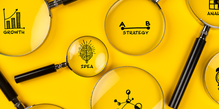 business plan concept with icons and magnifying glasses