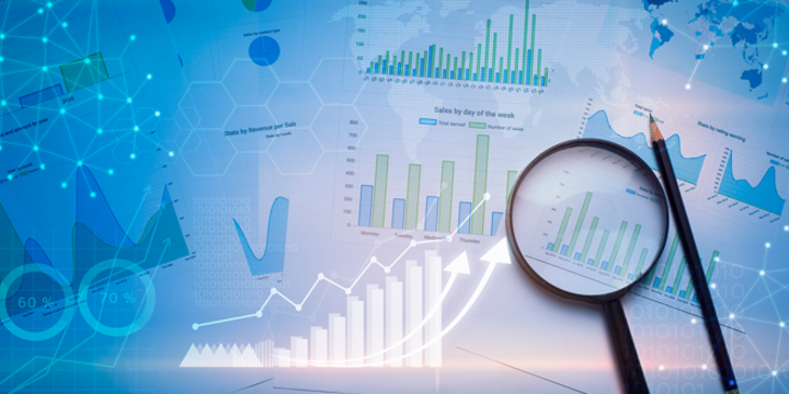 Magnifying glass and documents with analytics data lying on table , and digital virtual reality graph