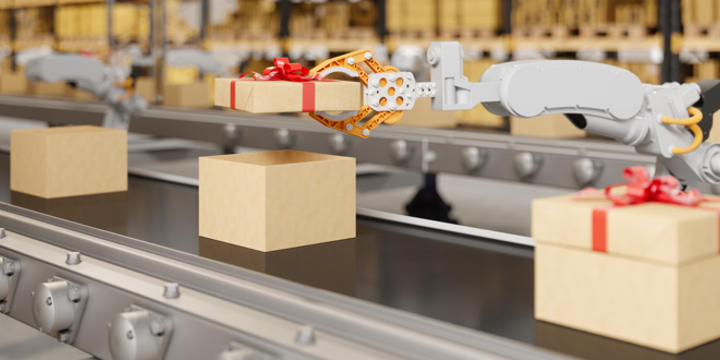 Robotic Arm Putting The Cover Of Gift Box On The Conveyor Belt