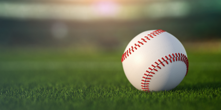 Baseball ball in a grass of baseball arena stadium