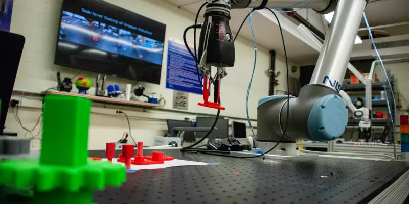 Robot arm picks up a red widget off a table