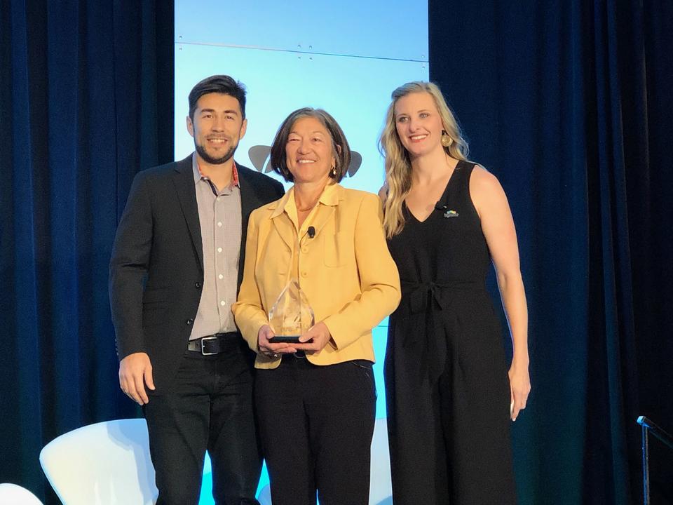 Terese Manley accepted an award from Topcoder on behalf of NIST PSCR. NIST PSCR was recognized for Public Sector Open Innovation by Topcoder.