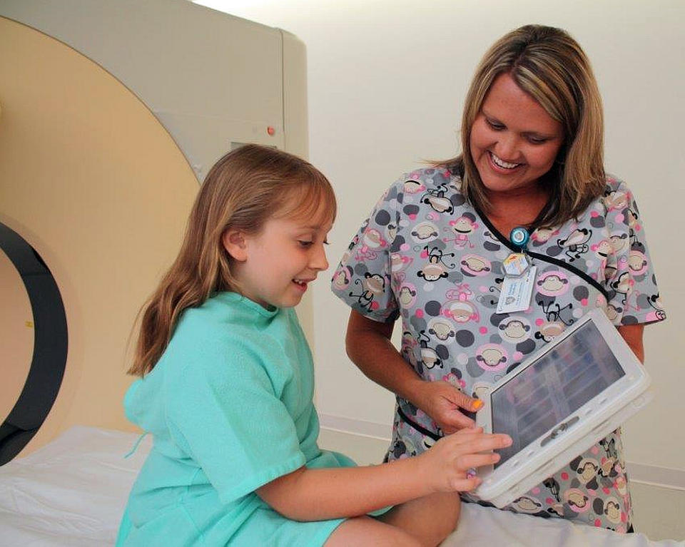 Charleston Area Medical Center Health System photo of a nurse and a patient looking at scans.