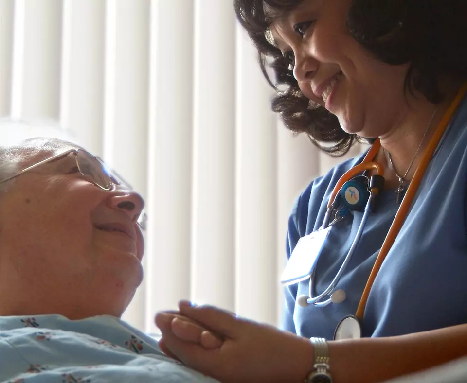 Henry Ford Health System photo of nurse with patient.