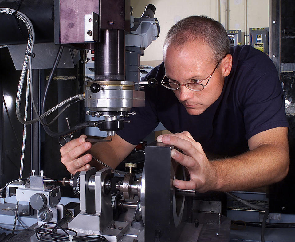 Honeywell Federal Manufacturing & Technologies, LLC photo of employee working on components.